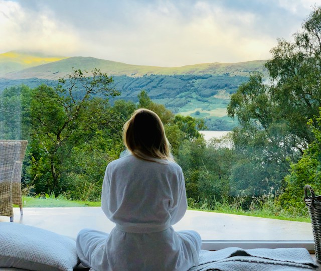 Sitting woman relaxing looking at mountains